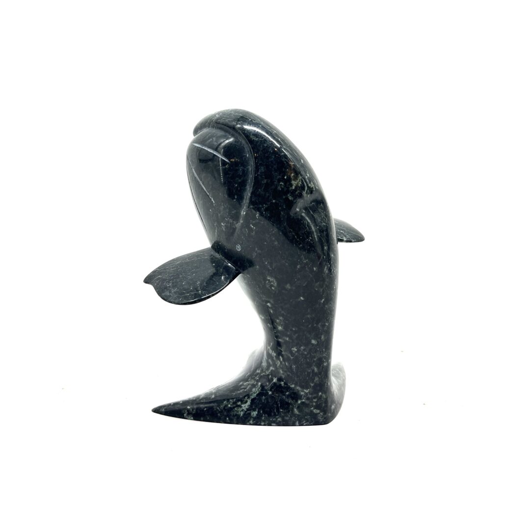 One original hand-carved sculpture by Inuit artist, Qoraq Nungsuitok. One whale sculpture carved out of serpentine.