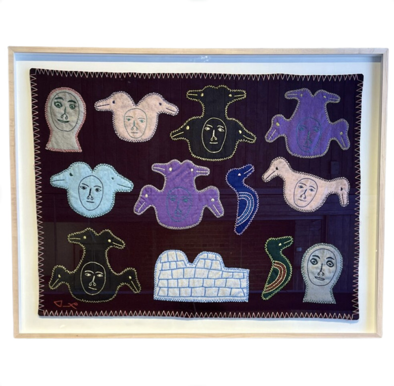 One original wall hanging by Inuit artist, Marjorie Aqigaaq. One framed transformation wall hanging made out of felt.