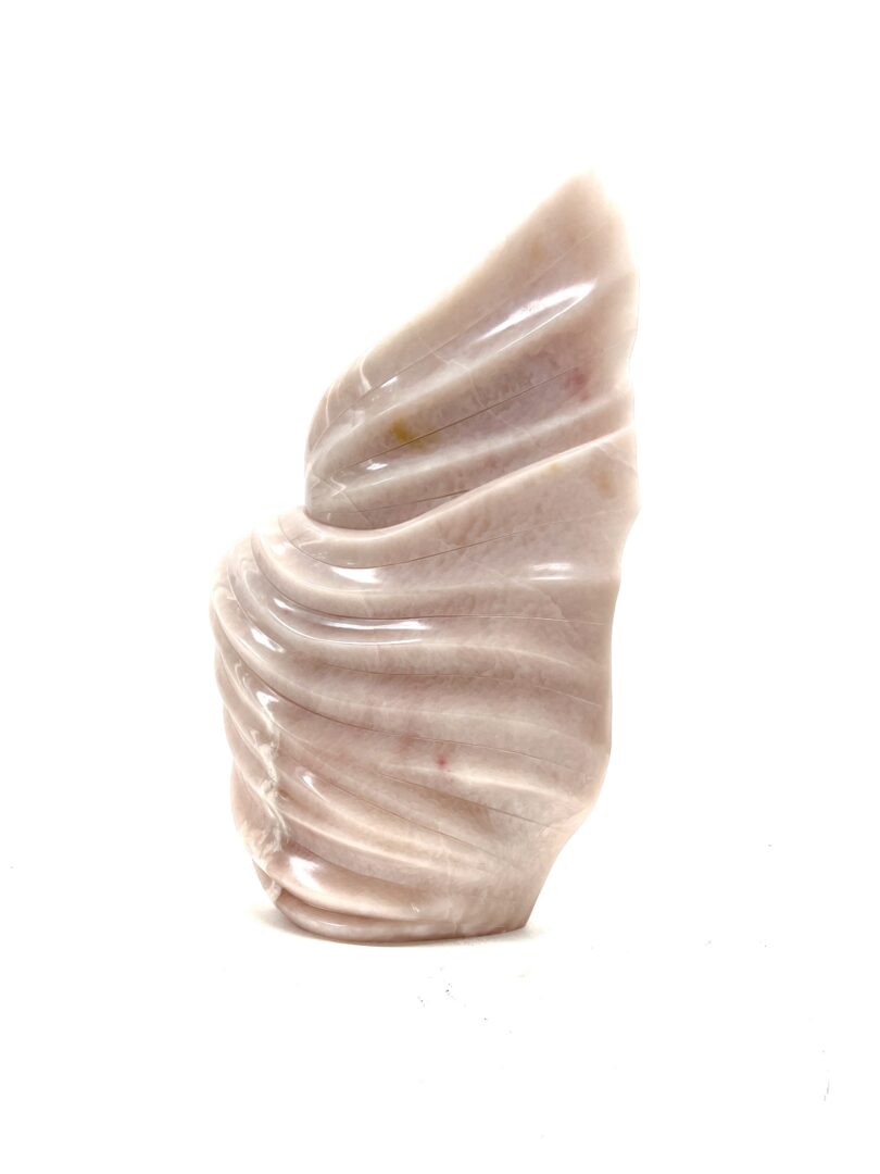 One original hand-carved sculpture by Iroquois artist, Eric Silver. One wind spirit carved out of pink soapstone.
