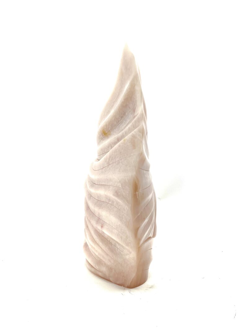 One original hand-carved sculpture by Iroquois artist, Eric Silver. One wind spirit carved out of pink soapstone.