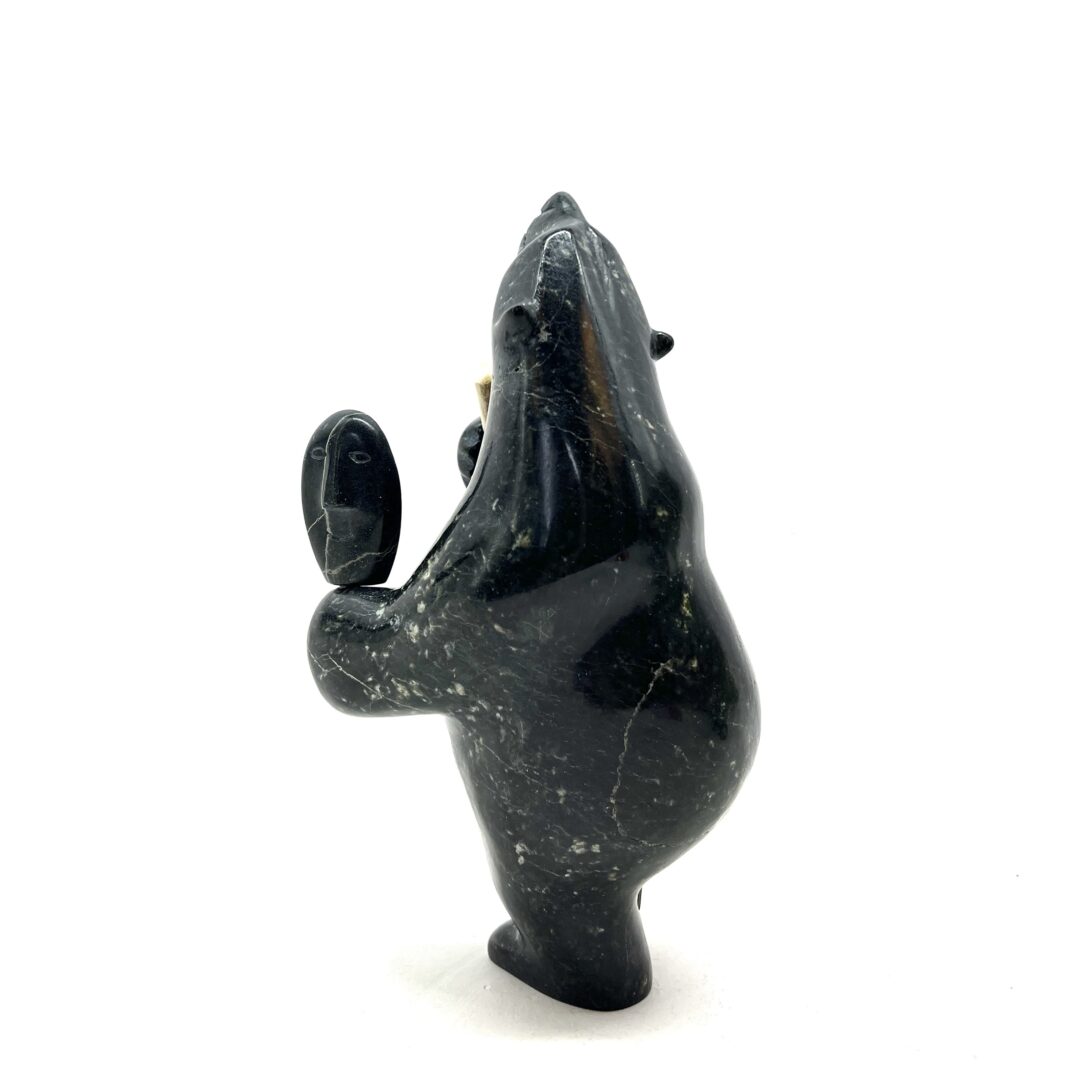 One original hand-carved sculpture by Inuit artist, Etidloie Adla. One drum dancing bear carved out of serpentine.