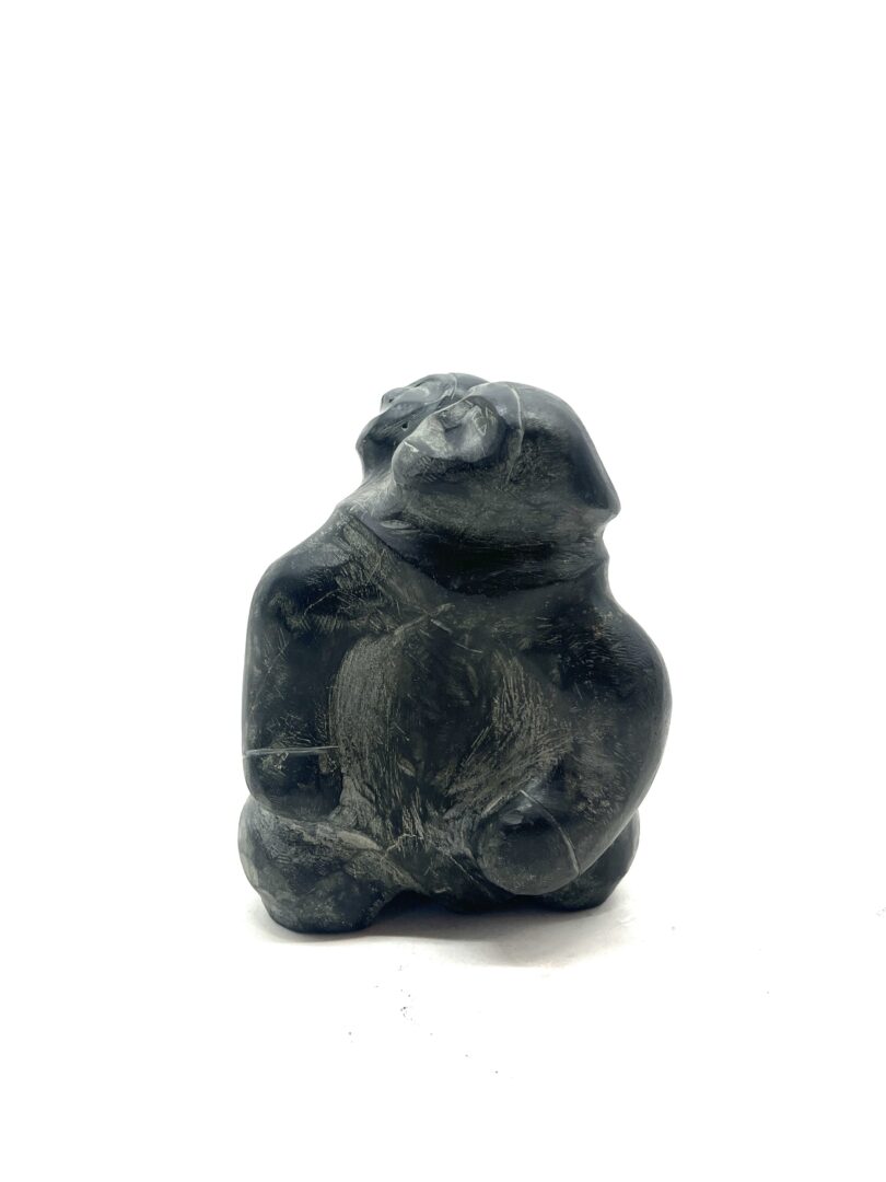 One original hand-carved sculpture by Inuit artist, Barnabus Arnasungaaq. One mother and child carved out of basalt.