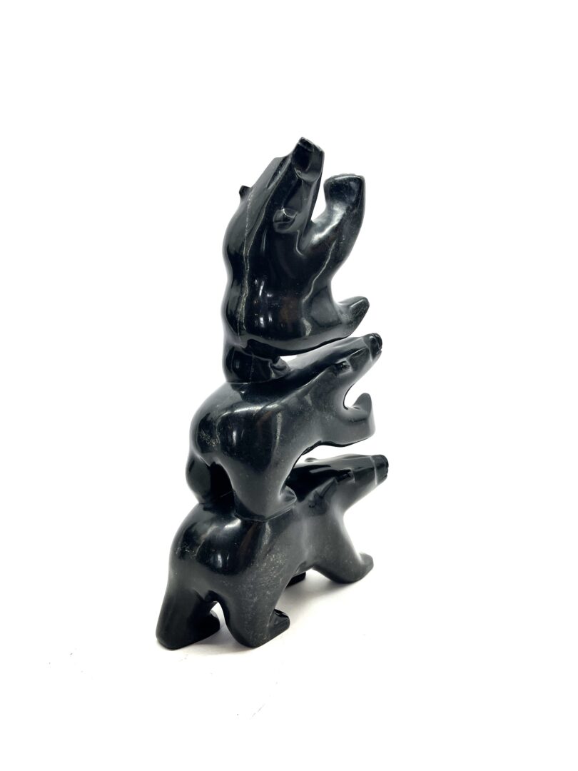 One original hand-carved sculpture by Inuit artist, Joanie Ragee. Three bears sculpture carved out of serpentine.