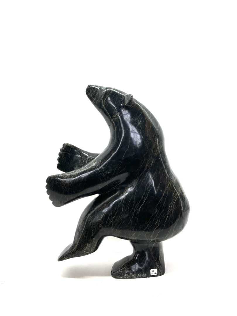 One original hand-carved sculpture by Inuit artist, Nuna Parr. One dancing bear sculpture carved out of serpentine.