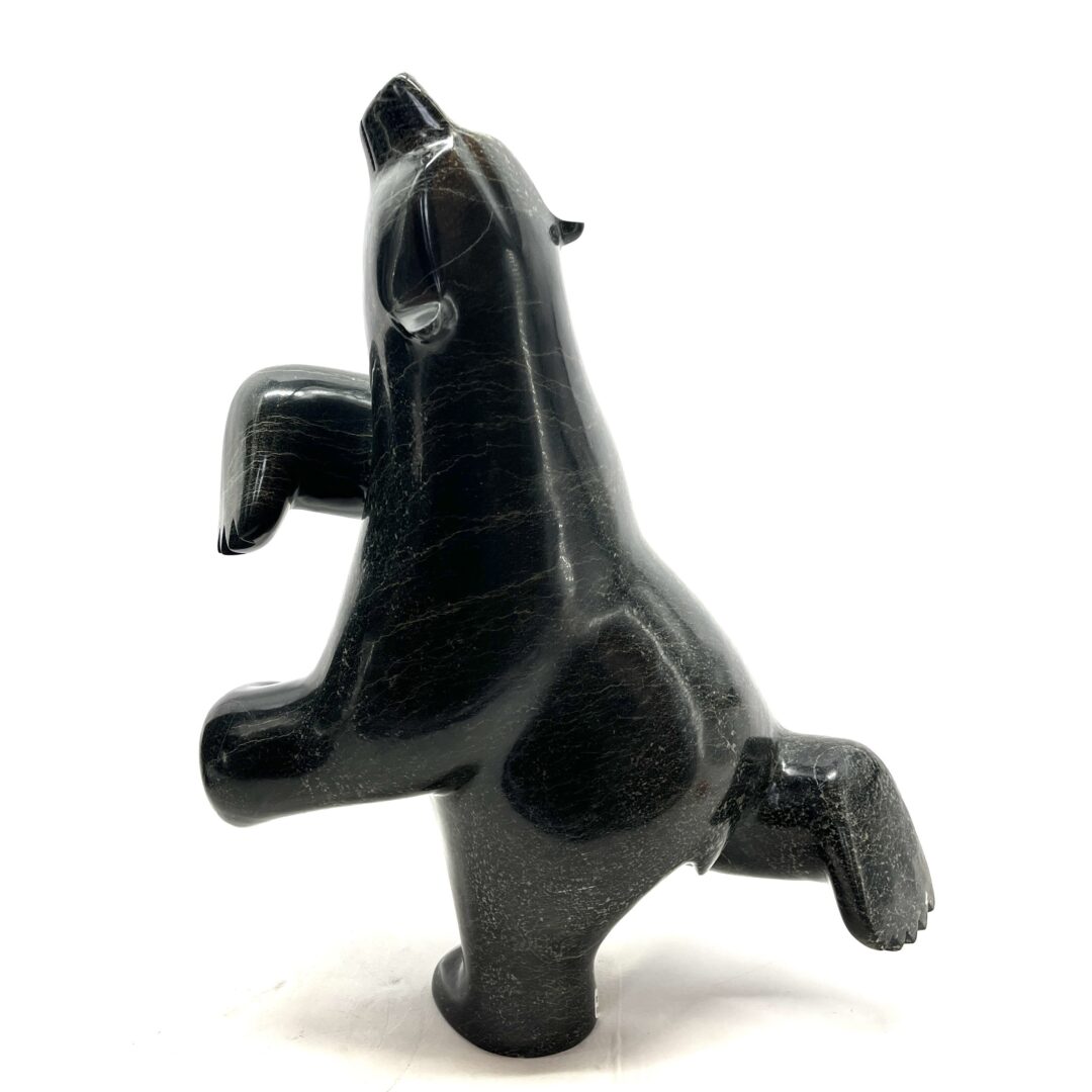 One original hand-carved sculpture by Inuit artist, Ashevak Adla. One dancing bear carved out of serpentine.