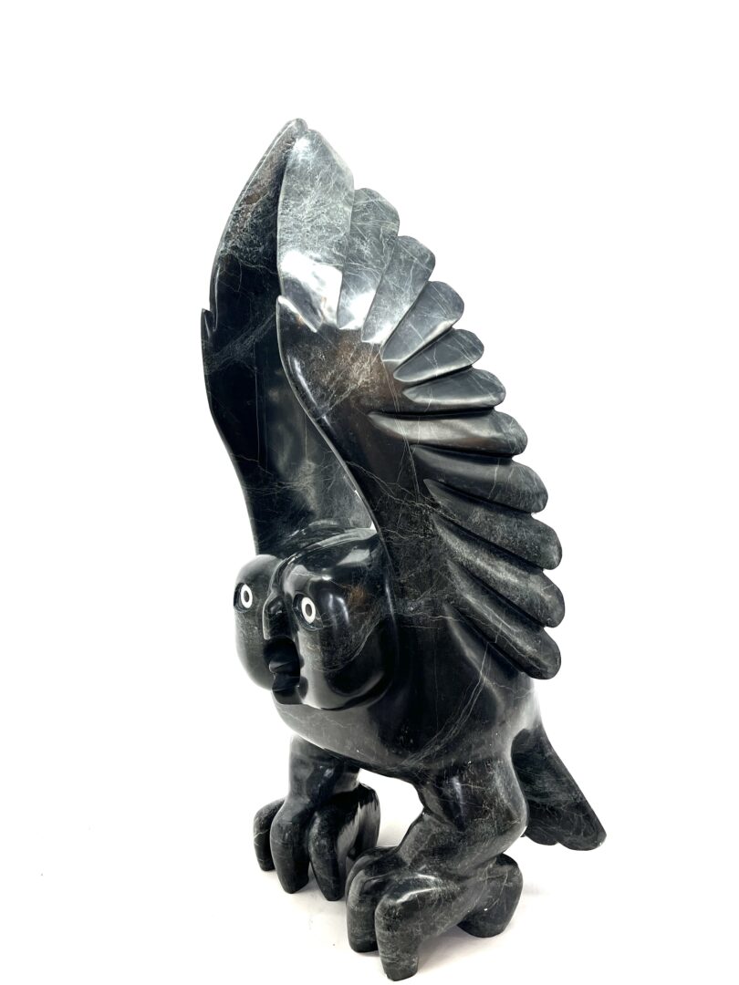 One original hand-carved sculpture by Inuit artist, Toonoo Sharky. One owl sculpture carved out of serpentine.