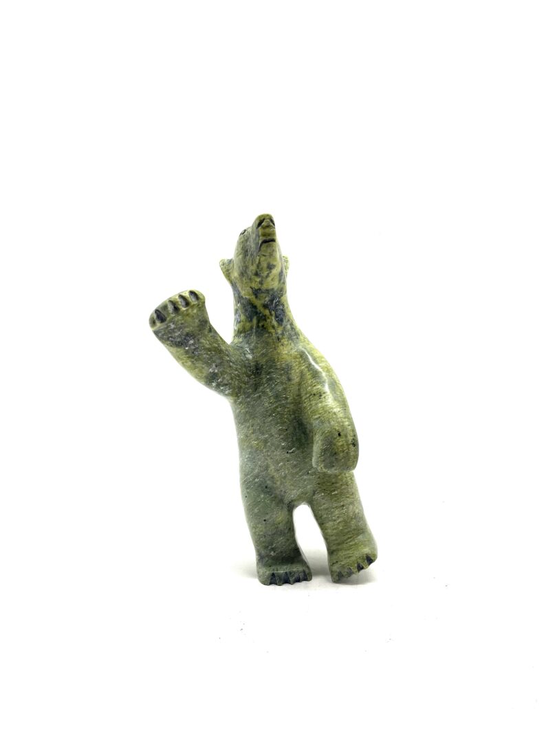One original hand-carved sculpture by Inuit artist, Kooyoo Peter. One two way bear carved out of serpentine.
