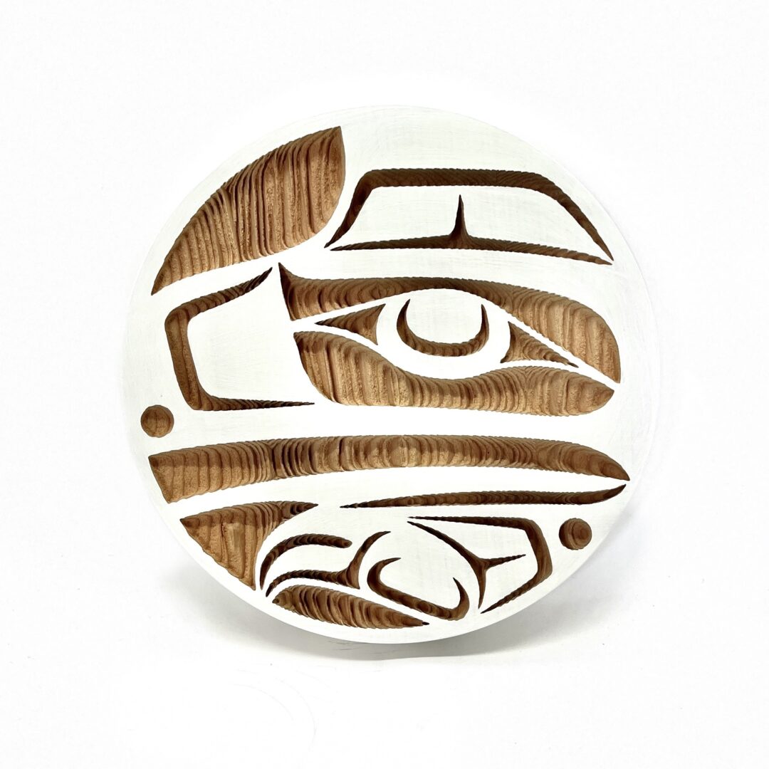 One original hand-carved panel by Nuxalk artist, Nusmata. One raven panel carved out of cedar wood and acrylic paint.