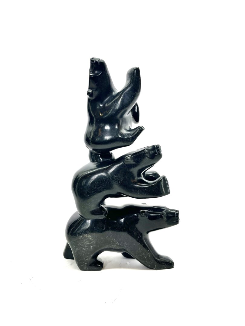 One original hand-carved sculpture by Inuit artist, Joanie Ragee. Three bears sculpture carved out of serpentine.