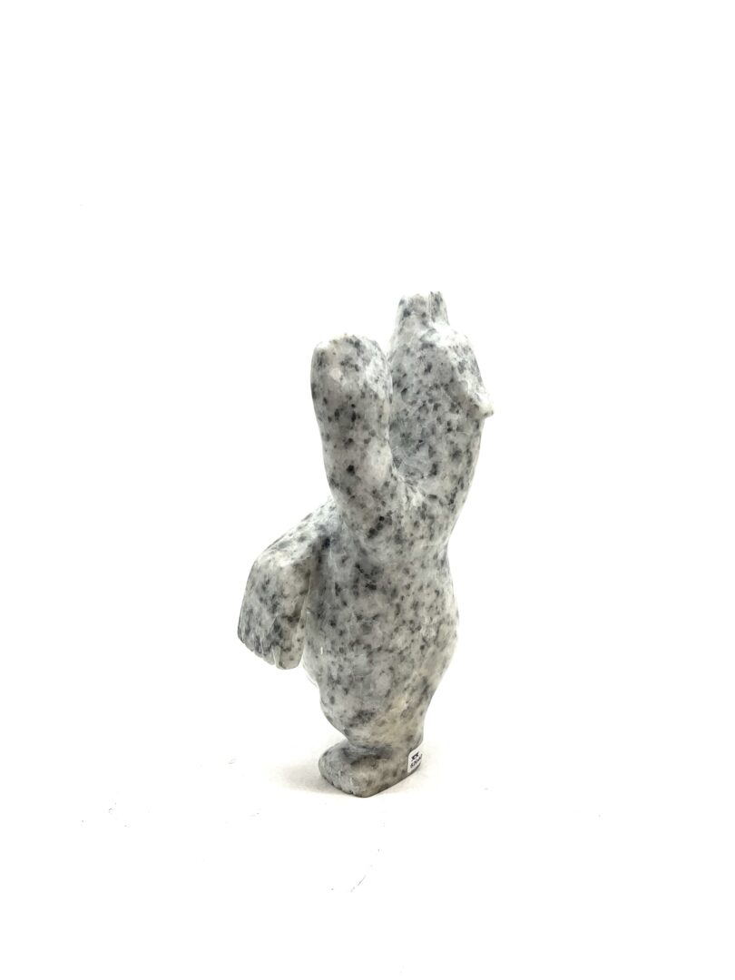 One original hand-carved sculpture by Inuit artist, Adamie Mathewsie. One dancing bear carved out of white marble.
