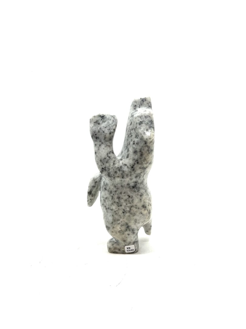 One original hand-carved sculpture by Inuit artist, Adamie Mathewsie. One dancing bear carved out of white marble.