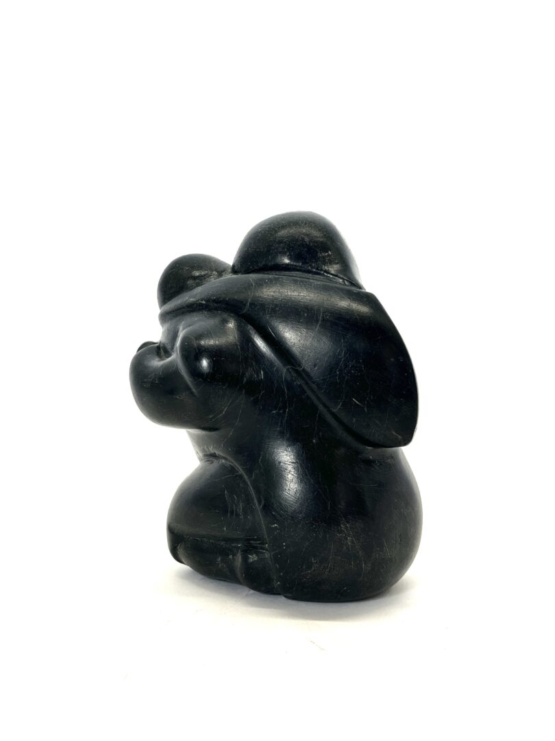 One original hand-carved sculpture by Inuit artist, Mathew Aqigaak. One mother and child carved out of basalt.