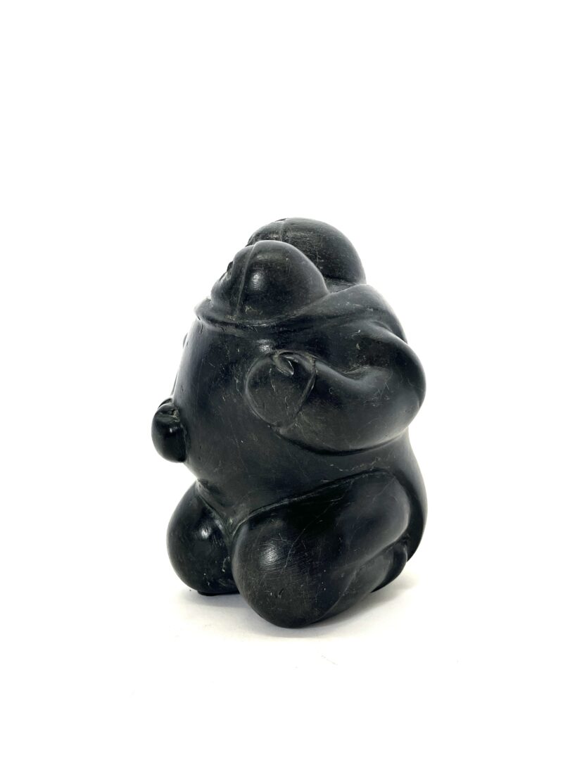 One original hand-carved sculpture by Inuit artist, Mathew Aqigaak. One mother and child carved out of basalt.