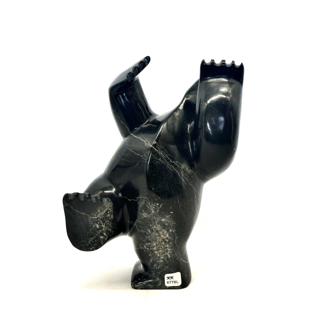 One original hand-carved sculpture by Inuit artist, Killiktee Killiktee. One dancing bear carved out of serpentine.