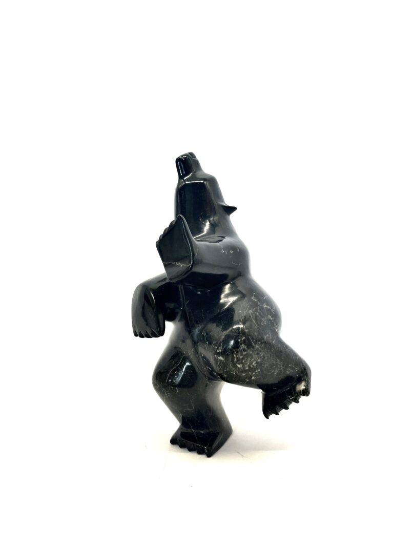 One original hand-carved sculpture by Inuit artist, Killiktee Killiktee. One dancing bear carved out of serpentine.