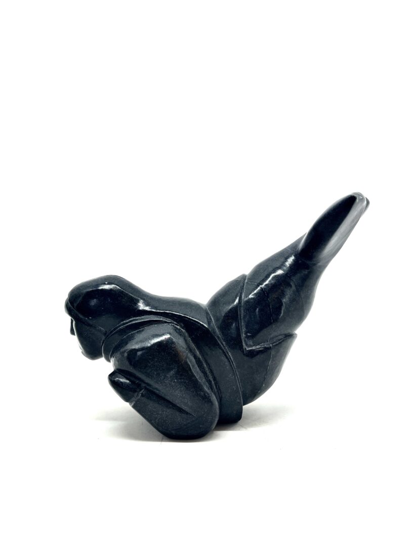 One original hand-carved sculpture by Inuit artist, Johnny Natarariaq. One Sedna sculpture carved out of serpentine.