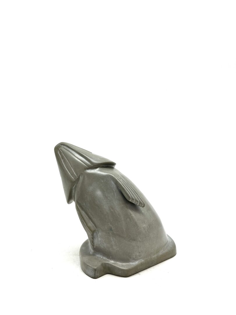 One original hand-carved sculpture by Inuit artist, Gordon Kyak. One jumping fish carved out of soapstone.