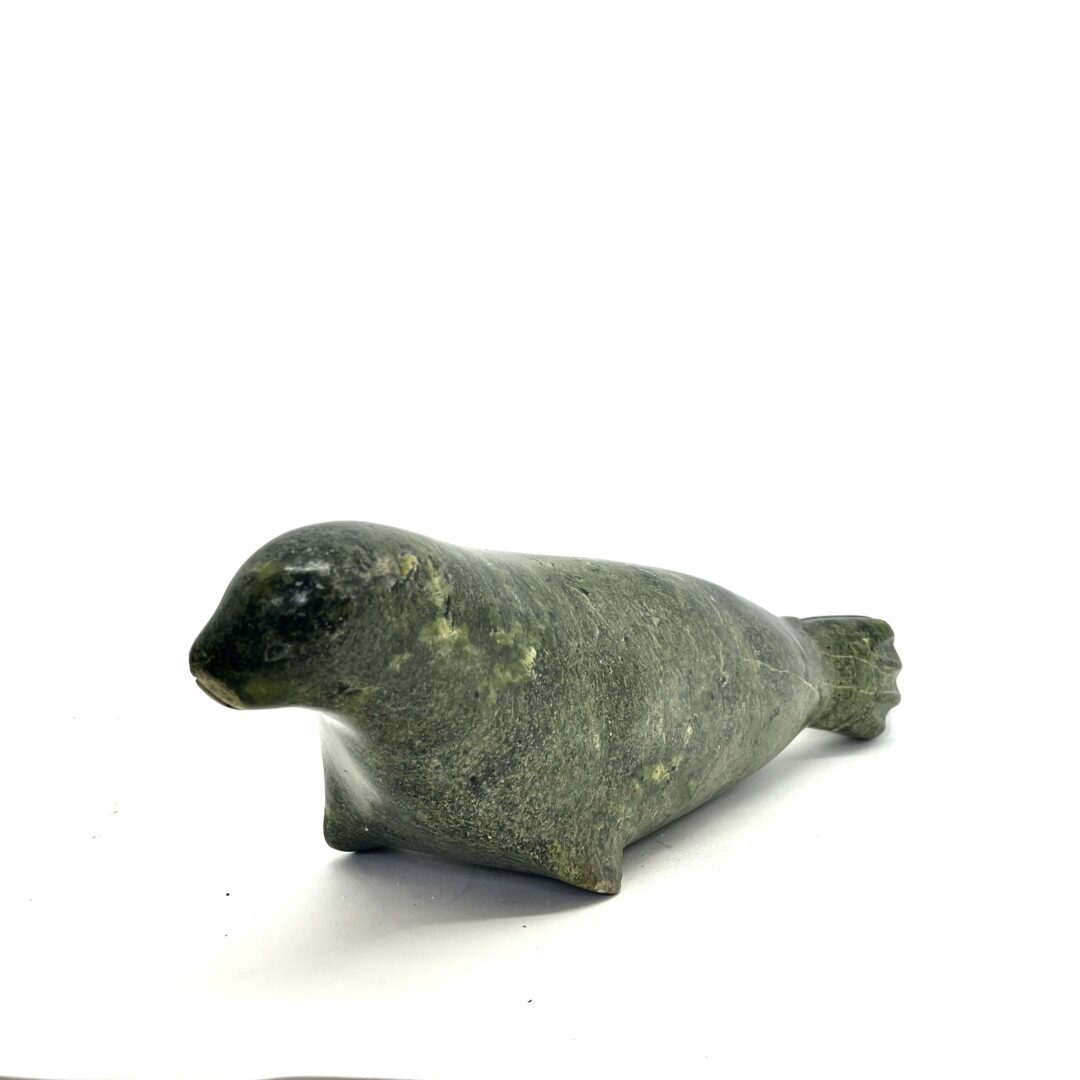 One original hand-carved sculpture by an unknown Inuit artist. One seal sculpture carved out of serpentine.