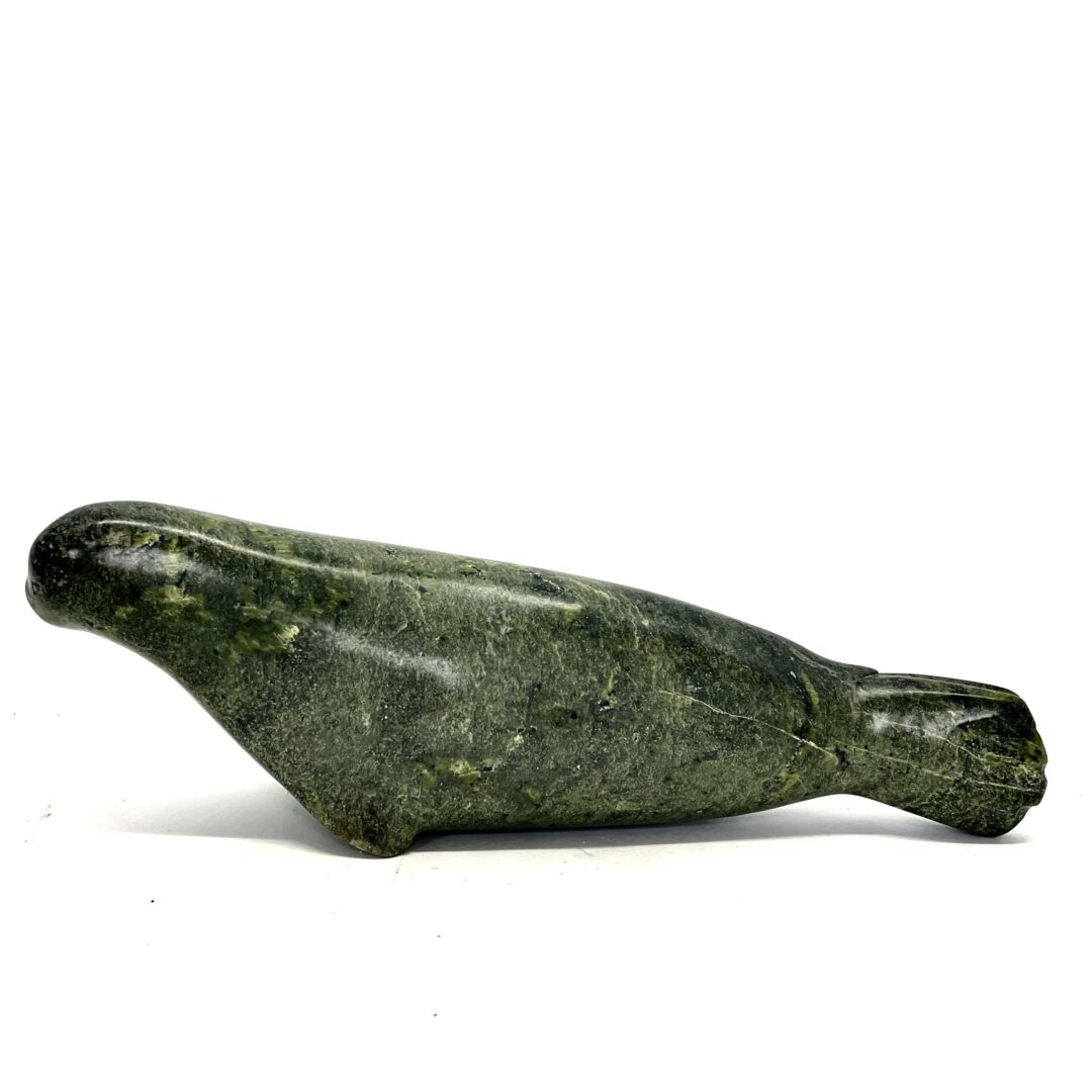 One original hand-carved sculpture by an unknown Inuit artist. One seal sculpture carved out of serpentine.