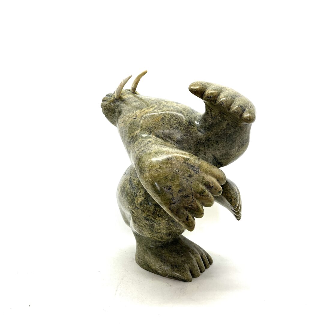 One original hand-carved sculpture by Inuit artist, Axangayuk Shaa (RCA). One dancing walrus carved out of serpentine.
