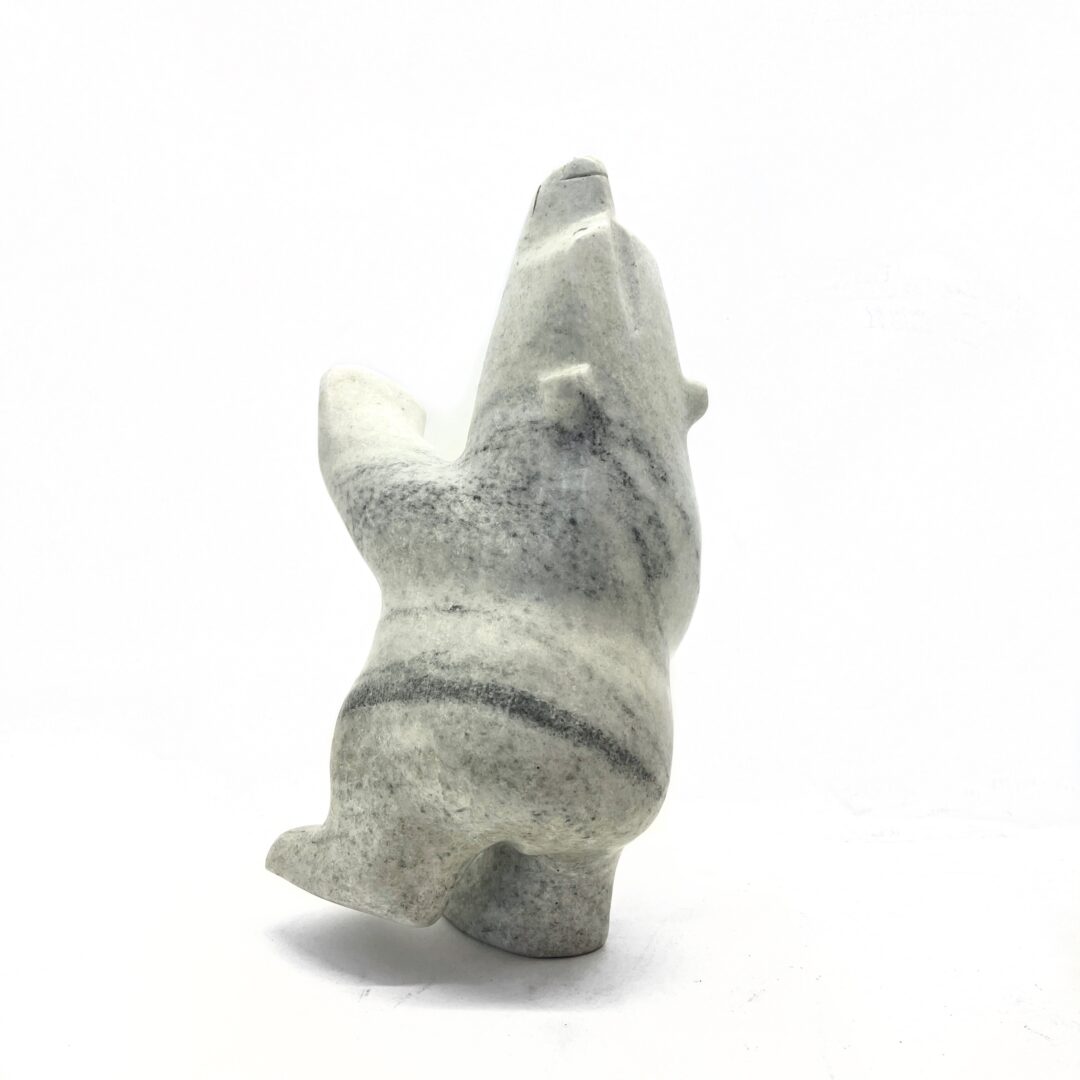 One original hand-carved sculpture by Inuit artist, Joanie Ragee. One dancing bear carved out of white marble.