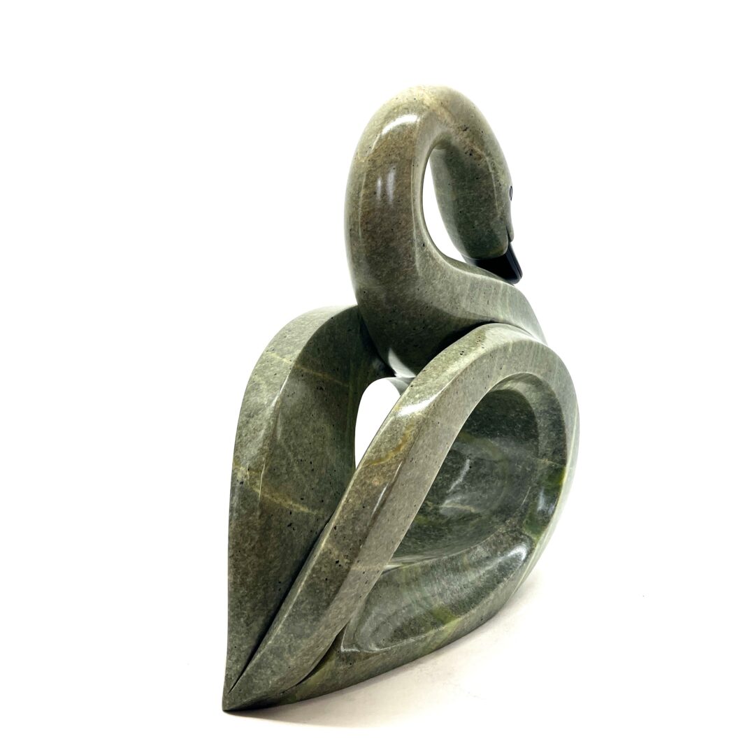 One original hand-carved sculpture by Iroquois artist, Eric Silver. One swan sculpture carved out of soapstone.