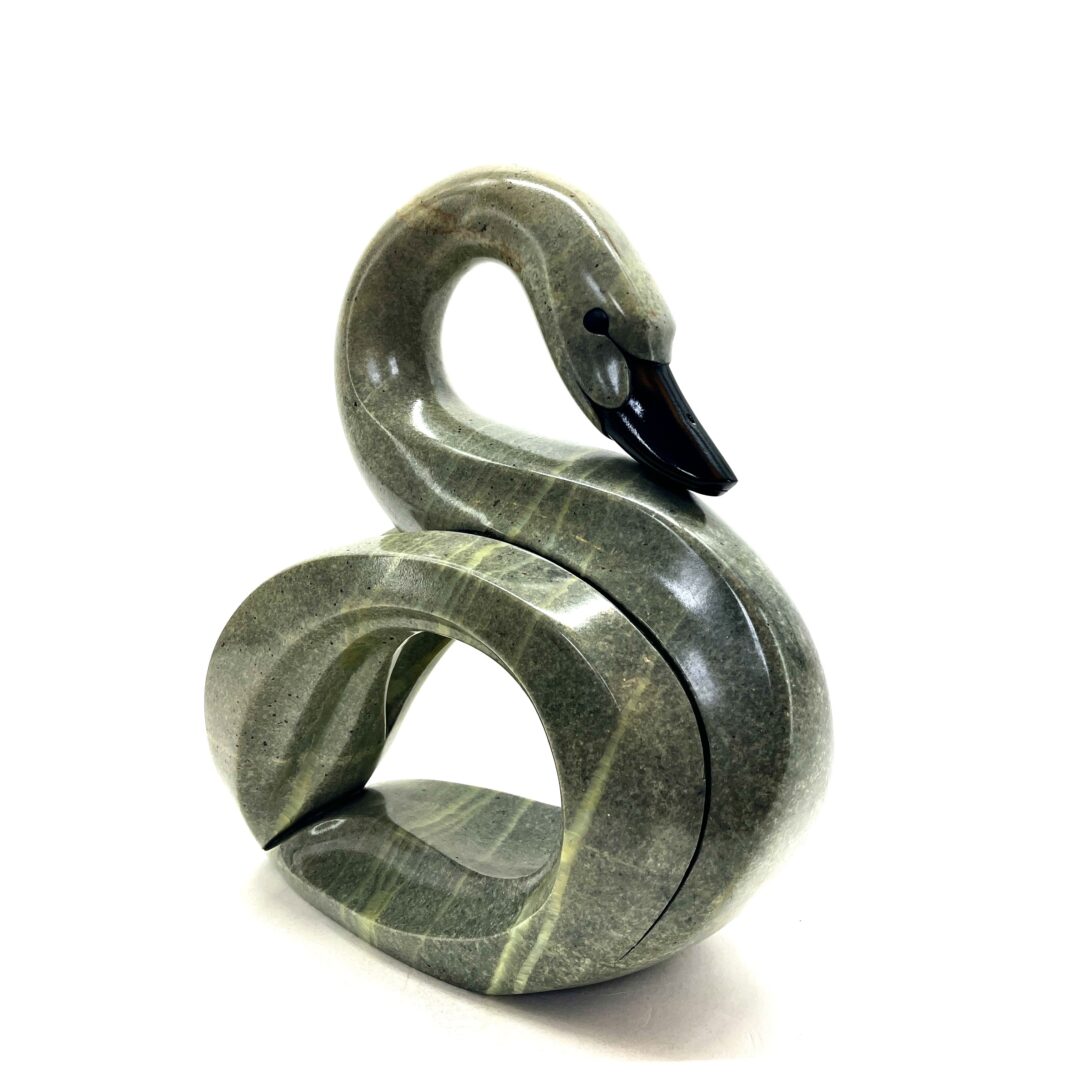 One original hand-carved sculpture by Iroquois artist, Eric Silver. One swan sculpture carved out of soapstone.
