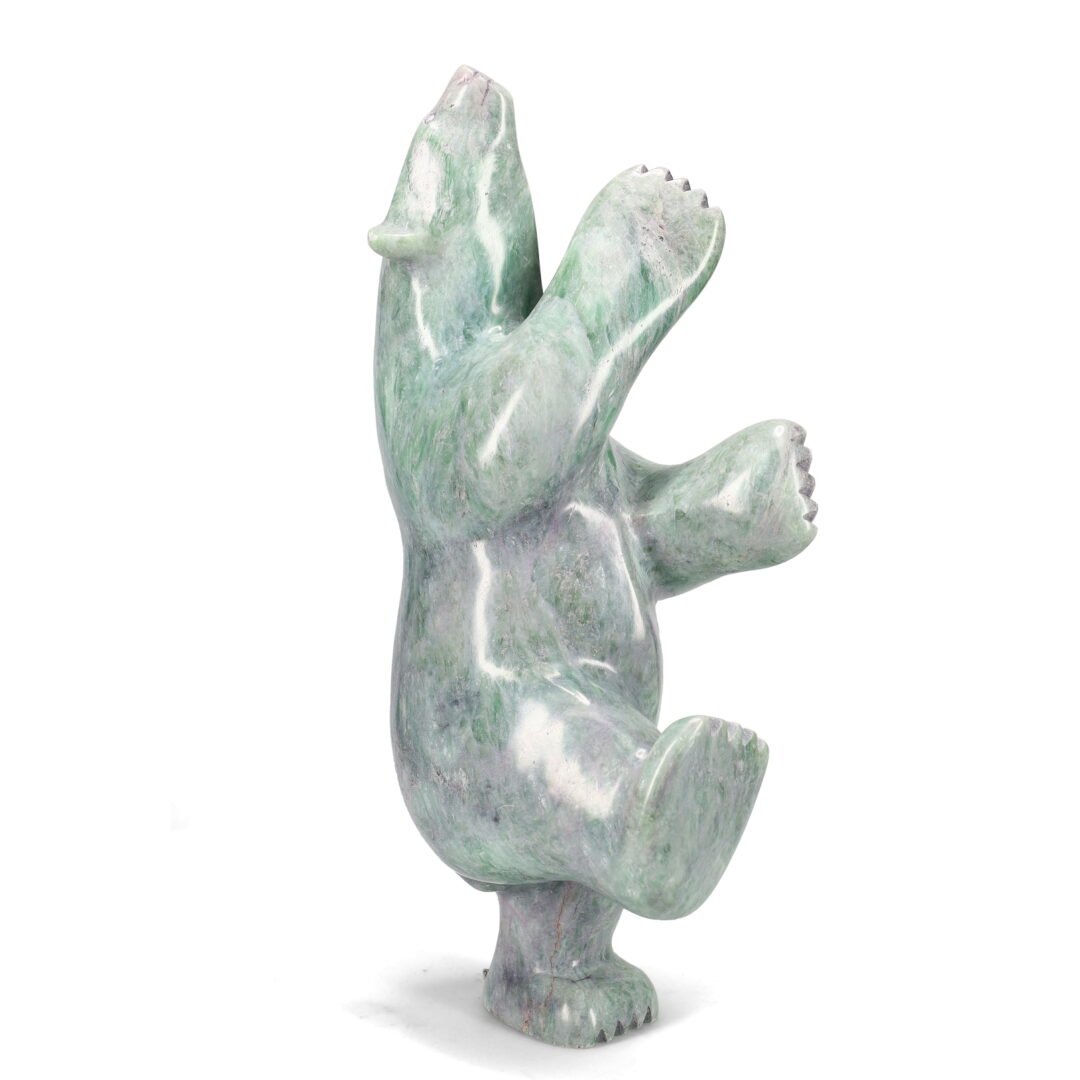 One original hand-carved sculpture by Inuit artist Etidloie Adla. One dancing bear carved out of soapstone.
