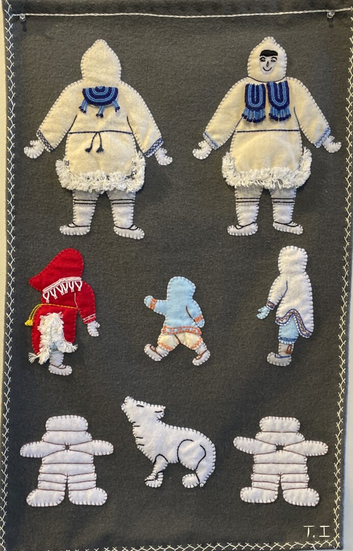 One original wall hanging by Inuit artist Theresa Ishalook. One felt and beaded tapestry of everyday Inuit life.