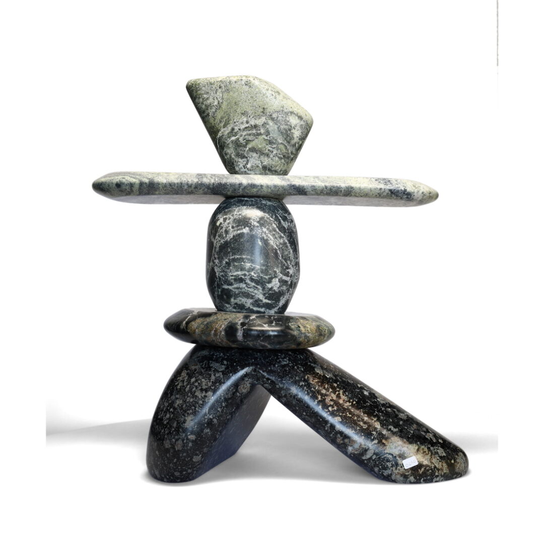 One original hand-carved sculpture by Ojibway artist Paul Bruneau. One inukshuk carved out of serpentine
