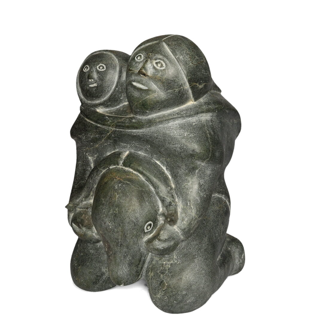 One original hand-carved sculpture by Inuit artist Mathew Aqigaaq. One Mother and Child carved out of basalt stone.