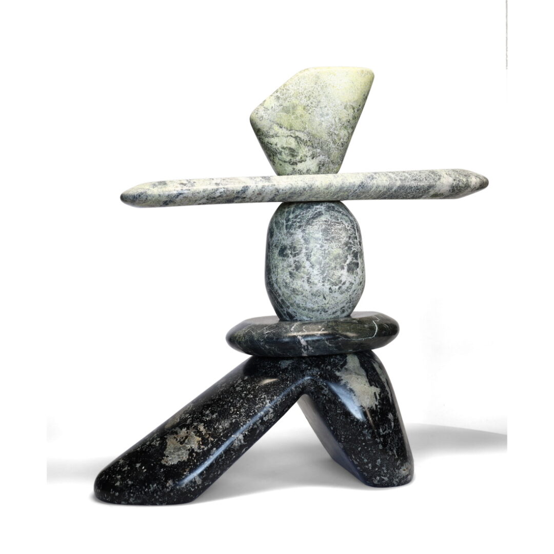 One original hand-carved sculpture by Ojibway artist Paul Bruneau. One inukshuk carved out of serpentine stone.
