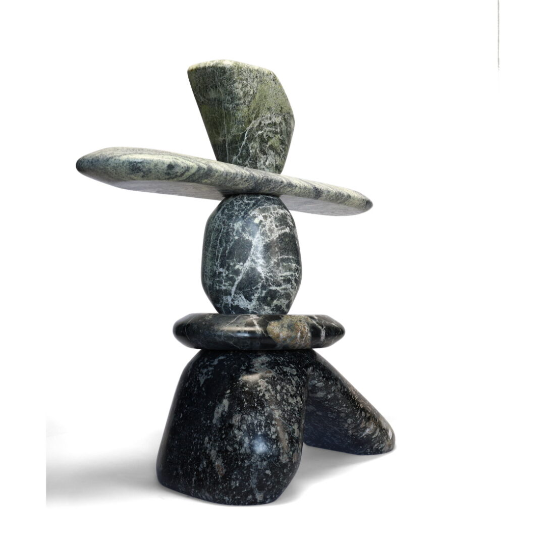One original hand-carved sculpture by Ojibway artist Paul Bruneau. One inukshuk carved out of serpentine stone.