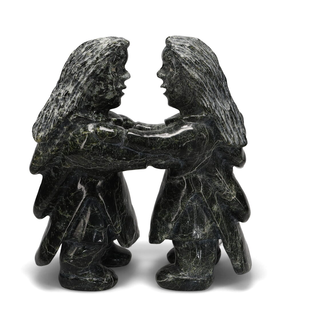 One original hand-carved sculpture by Inuit artist Jomie Aipeelee. Two throat singers carved out of serpentine.