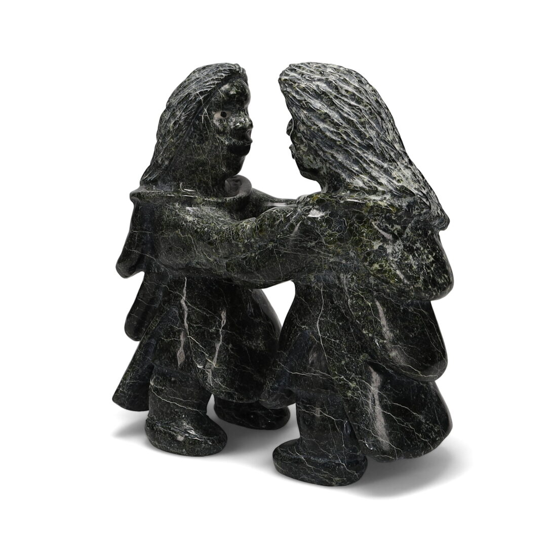 One original hand-carved sculpture by Inuit artist Jomie Aipeelee. Two throat singers carved out of serpentine.