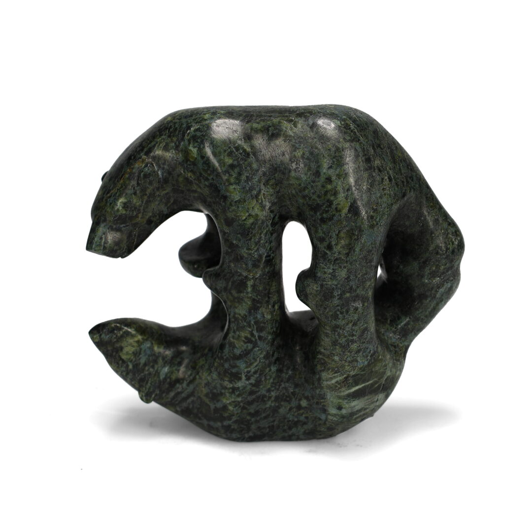 One original hand-carved sculpture by Inuit artist Tony Oqutaq. One Mirror Bear carved out of serpentine stone.