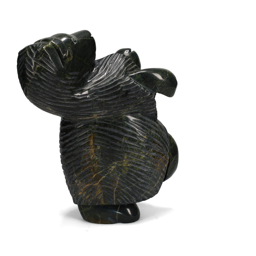 One original hand-carved sculpture by Inuit artist Pitsulak Qimirpik. One dancing muskox carved out of serpentine.