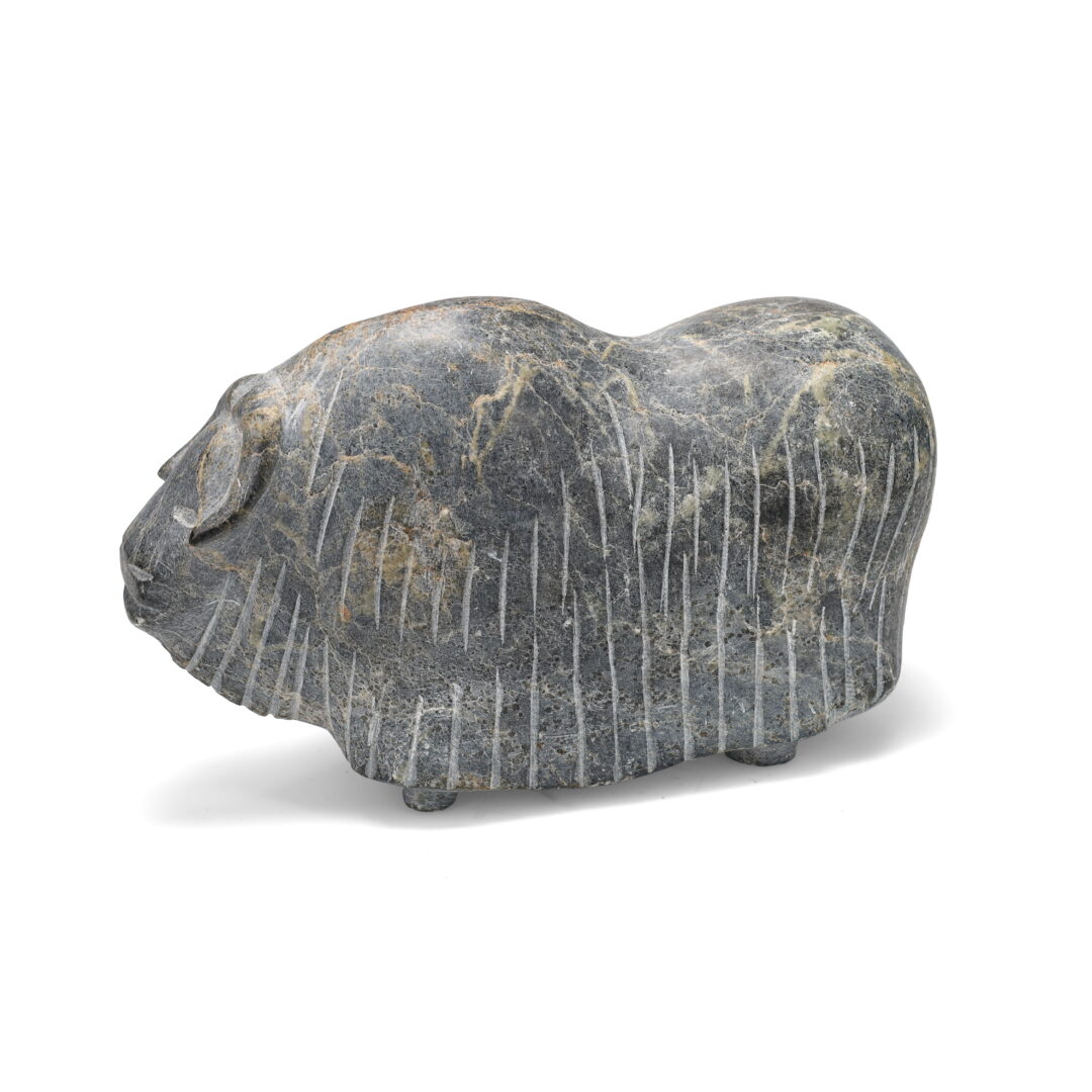 One original hand-carved sculpture by Inuit artist Martha Tickie (1939-2015). One musk ox carved out of basalt stone.