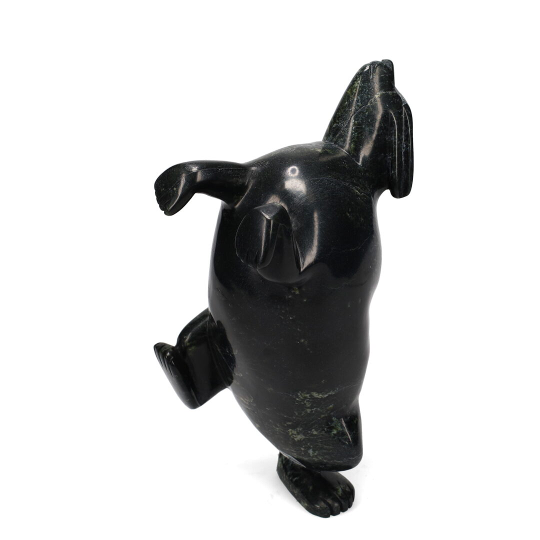 One original hand-carved sculpture by Inuit artist Pitseolak Qimirpik. One dancing rabbit carved out of serpentine.