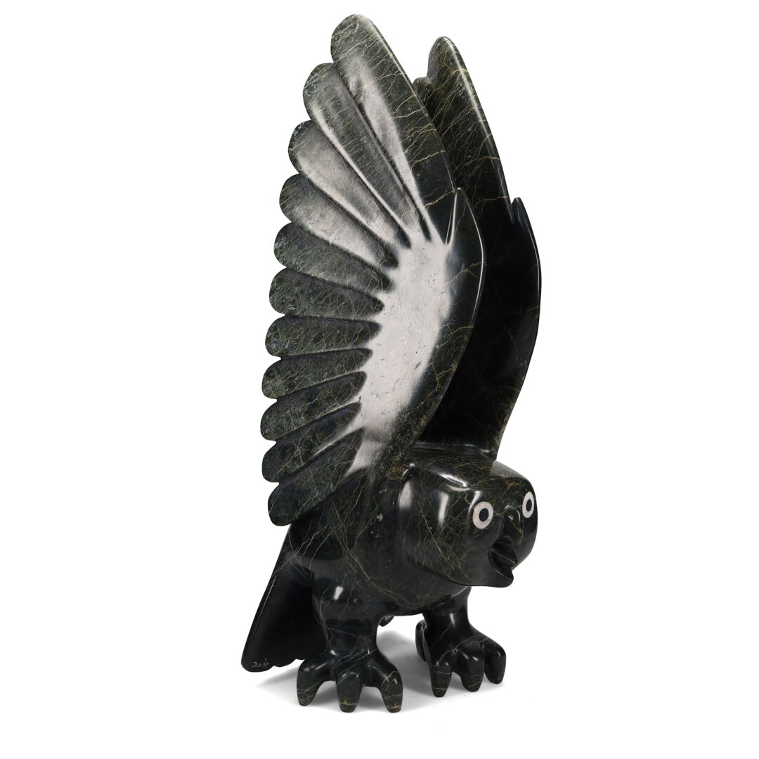One original hand-carved sculpture by Inuit artist Toonoo Sharky. One owl carved out of serpentine and caribou antler.