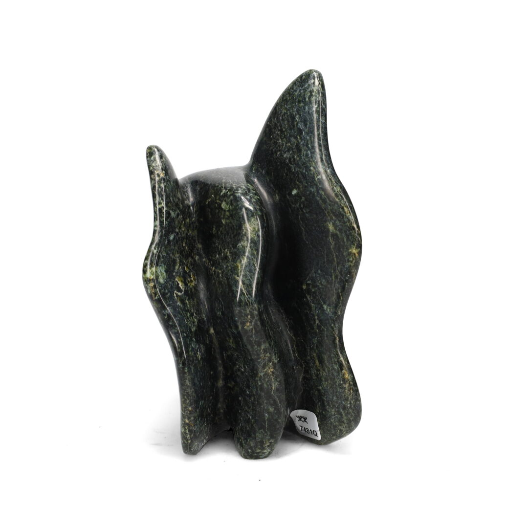 One original hand-carved sculpture by Inuit artist Toonoo Sharky. One two-headed creature carved out of serpentine.