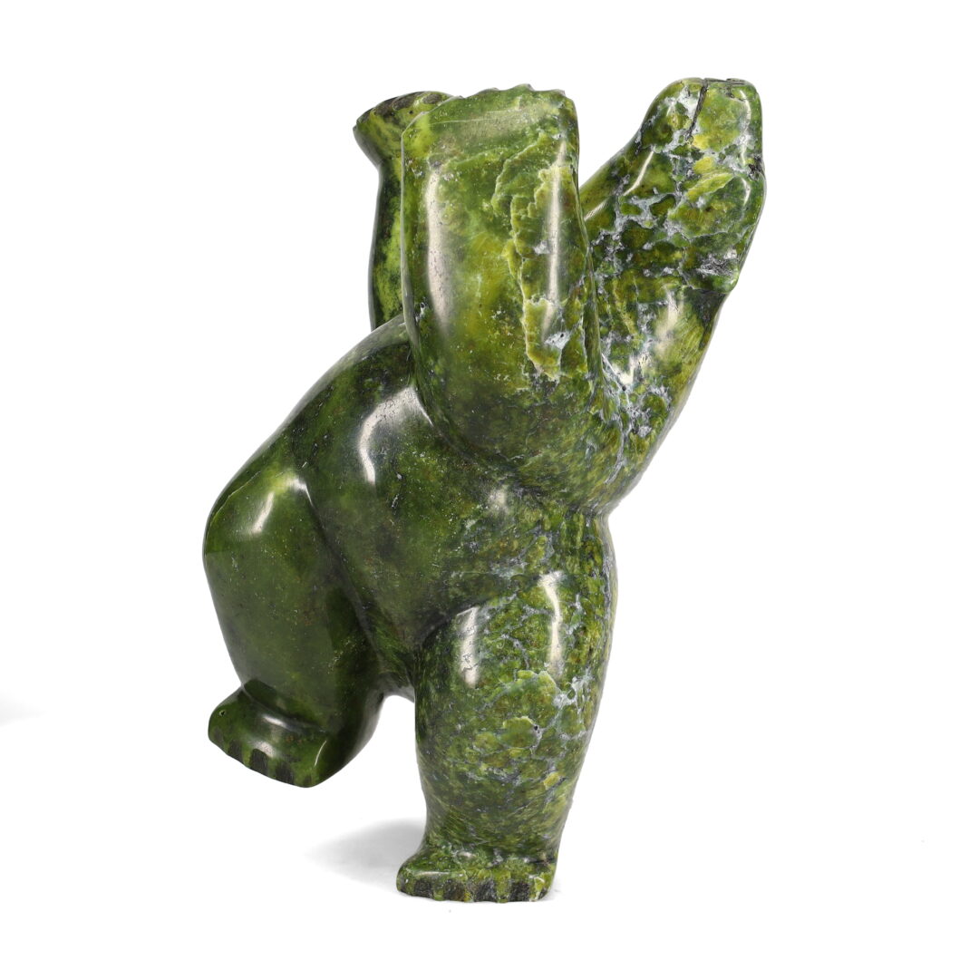 One original hand-carved sculpture by Inuit artist Isacie Petaulassie. One dancing bear carved out of serpentine.