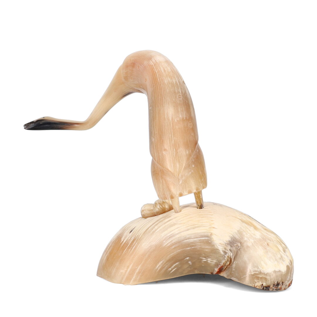 One original hand-carved sculpture by Inuit artist Buddy Alikamik Nutik. One crane carved out of musk ox horn.