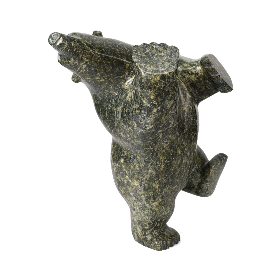 One original hand-carved sculpture by Inuit artist Joanie Ragee. One 3-way dancing bear carved out of serpentine.