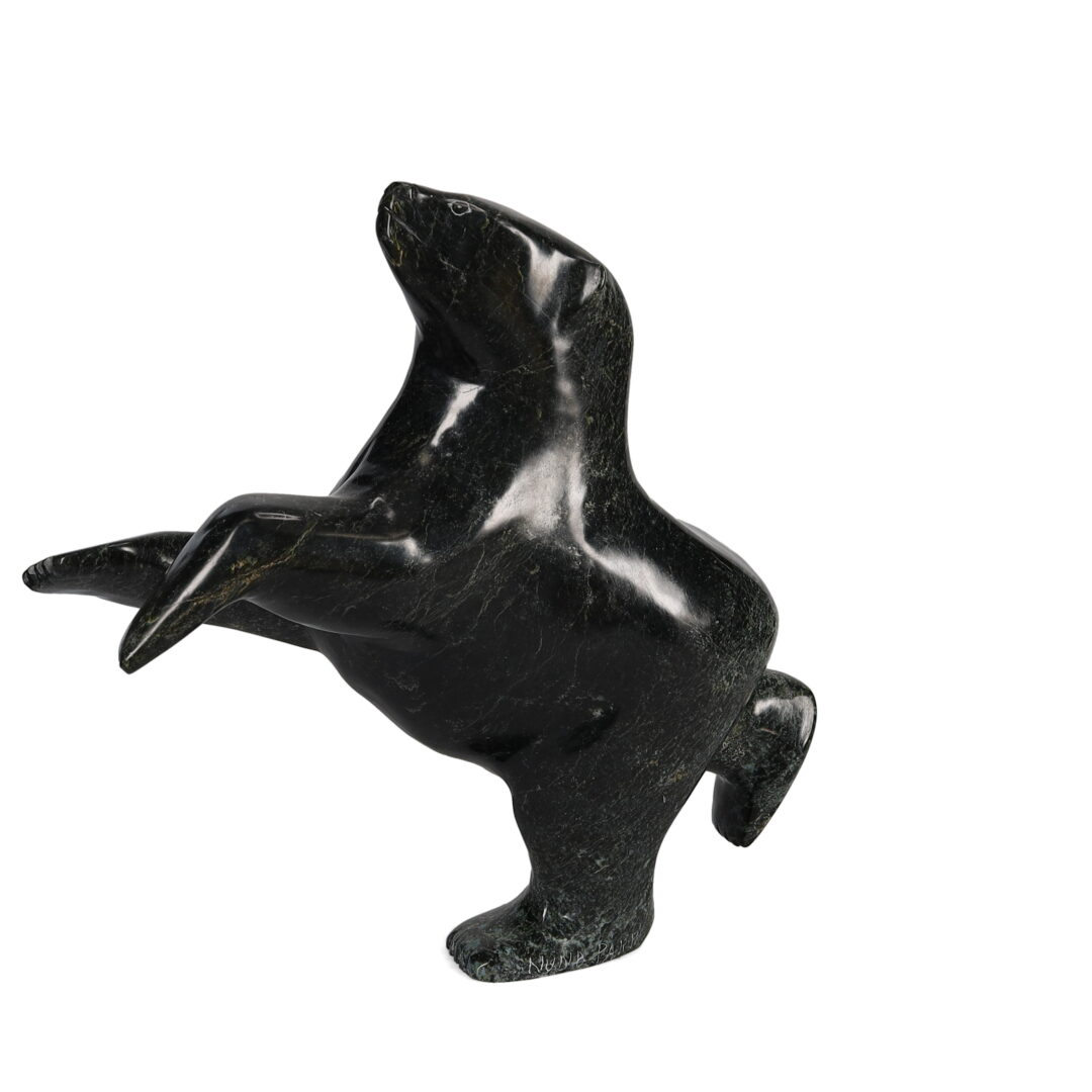 One original hand-carved sculpture by Inuit artist Nuna Parr. One dancing bear carved out of serpentine stone.
