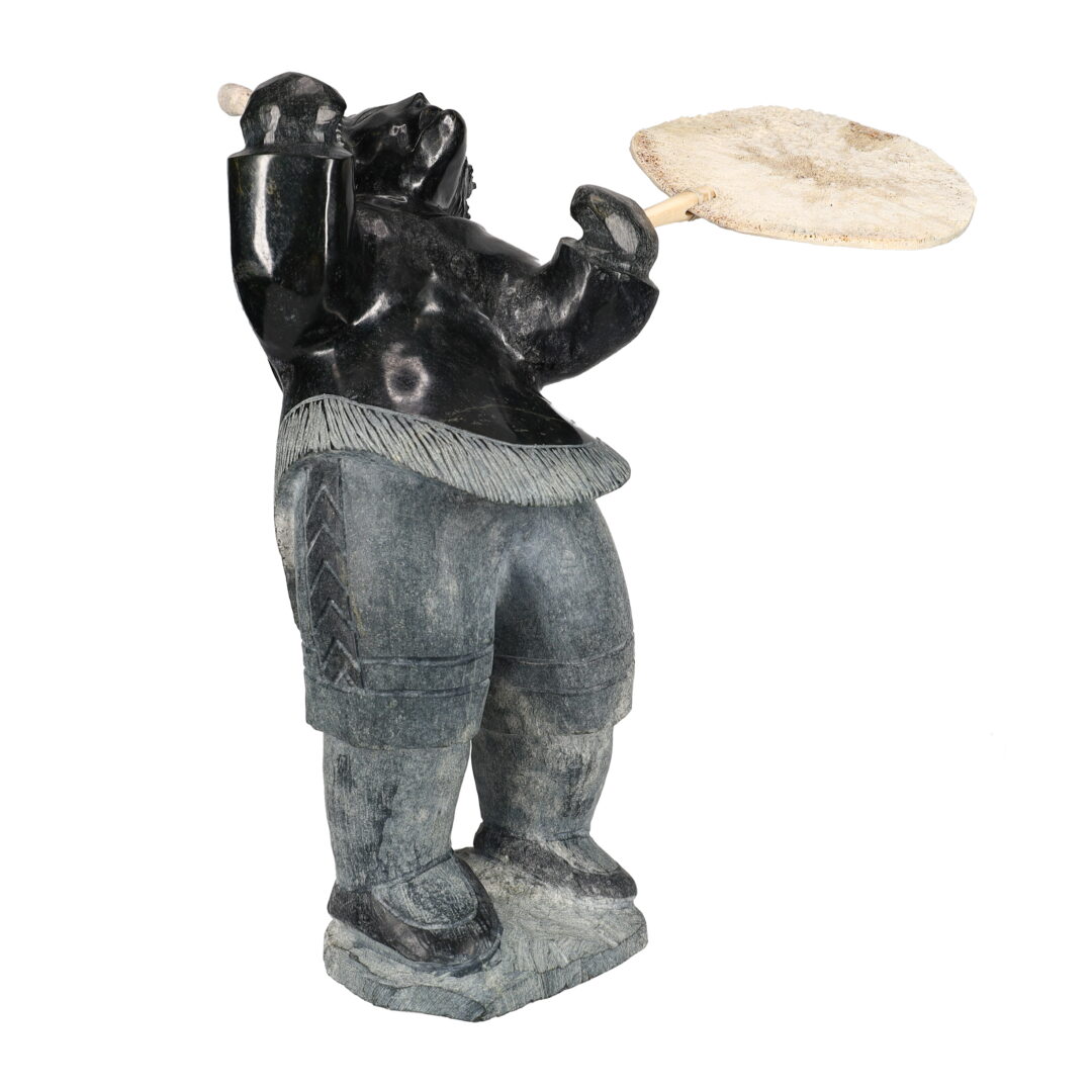 One original hand-carved sculpture by Inuit artist Jaco Ishulutak. One drum dancer carved out of serpentine.