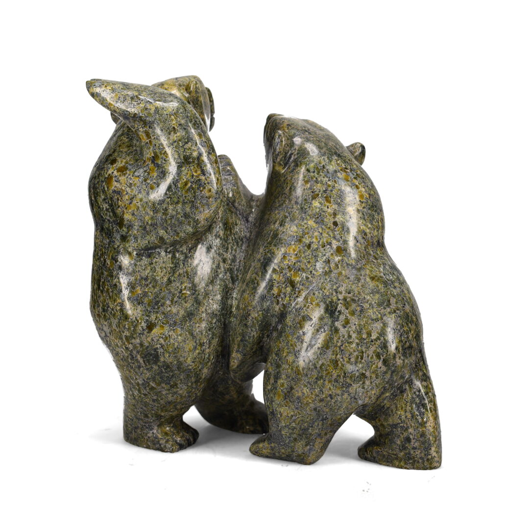 One original sculpture by Inuit artist, Pitseolak Oshutsiak. Two bears in action carved out of serpentine stone.