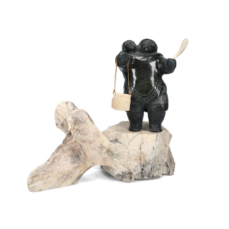 One original hand-carved sculpture by Inuit artist Jaco Ishulutak. One mother and child carved out of whalebone and serpentine.