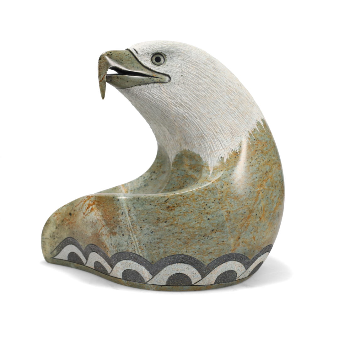 One original hand-carved sculpture by Inuit artist, Cyril Henry. One Guardian Eagle carved out of soapstone.