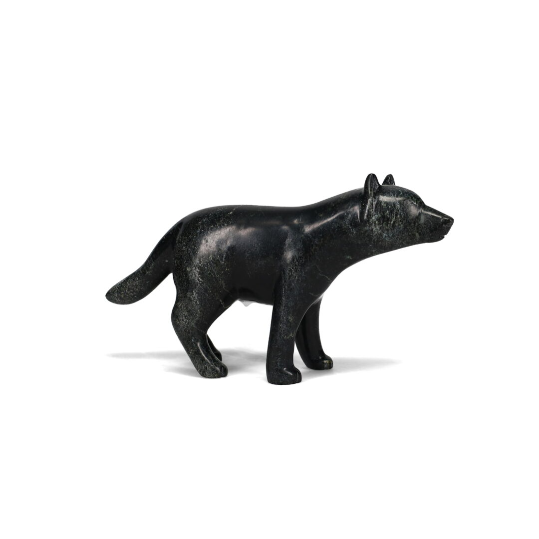 One original hand-carved sculpture by Inuit artist, Matt Flaherty. One wolf carved out of serpentine stone.